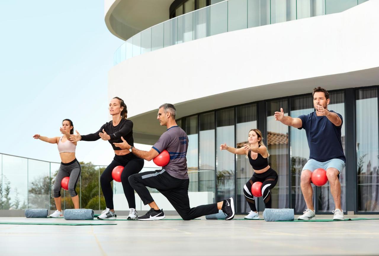 Longevity Health & Wellness Hotel - Adults Only Alvor Exterior photo A group of people exercising with a medicine ball